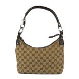 GUCCI - a Monogram canvas handbag. Designed with maker's signature GG canvas exterior and textured