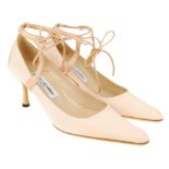 MANOLO BLAHNIK - a pair of kitten heel court shoes. Featuring a pale pink textile exterior with