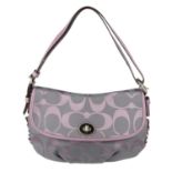 COACH - a lilac handbag. Crafted from the maker's monogram logo fabric exterior and lilac leather