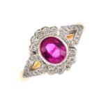 An 18ct gold ruby and diamond cluster ring. The oval shape ruby, with brilliant-cut diamond border