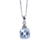 A 9ct gold aquamarine and diamond pendant. The cushion-shape aquamarine, with single-cut diamond