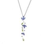 A peridot, tanzanite and diamond pendant. The vari-shape tanzanite and peridot foliate line, with