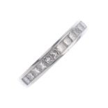 A platinum diamond half eternity ring. Designed as a square-shape diamond line, with tapered half