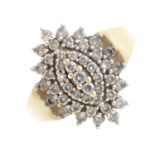 A 9ct gold diamond dress ring. Of marquise-outline, the brilliant-cut diamond stepped cluster,