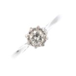 An 18ct gold diamond single-stone ring. The brilliant-cut diamond, within an illusion set, with