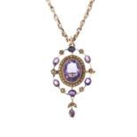 An early 20th century gold amethyst and split pearl pendant. Of openwork design, the oval-shape