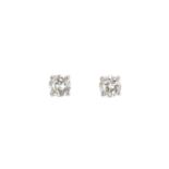 A pair of brilliant-cut diamond stud earrings. Total diamond weight 0.63ct, estimated H-I colour, SI