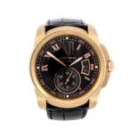 CARTIER - a Calibre De Cartier wrist watch. 18ct rose gold case with exhibition case back. Reference