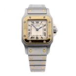 CARTIER - a Santos bracelet watch. Stainless steel case with yellow metal bezel. Reference 1567,