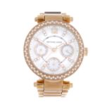 MICHAEL KORS - a lady's bracelet watch. Gold plated case with stainless steel case back. Reference
