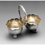 A late Victorian silver cruet, each open salt of circular crimped form with beaded rim, joined to