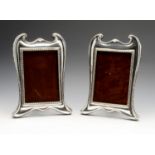 A matched pair of early twentieth century silver mounted photograph frames, the rectangular aperture