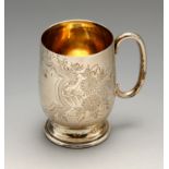 An Edwardian silver christening mug, of typical form with bright-cut floral sprigs surrounding a