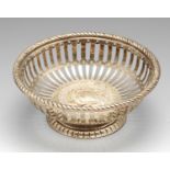 A late Victorian silver bonbon dish, of circular pierced form with rope-twist rim and embossed