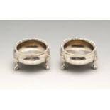 A pair of mid-Victorian silver open salts, each of circular form with applied gadrooned rim and