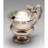 A George IV silver mustard pot by Matthew Boulton, of circular bellied form with embossed rim border