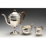 A George III silver composite part coffee service of matched style, comprising coffee pot, twin-