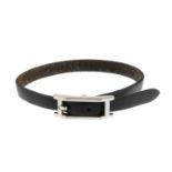 HERMÈS - a black leather bracelet. The silver-tone rectangular buckle, to the black strap with