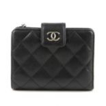 CHANEL - a lambskin leather quilted wallet. Featuring the maker's classic diamond quilted pattern to