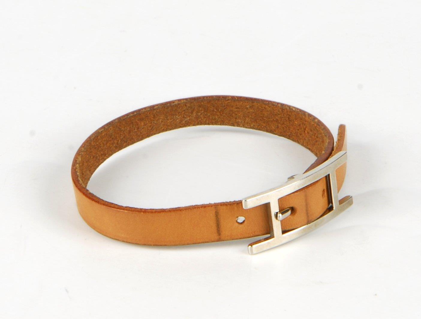 HERMÈS - a leather bracelet. Designed as a tan leather strap with silver-tone 'H' buckle - Image 2 of 2