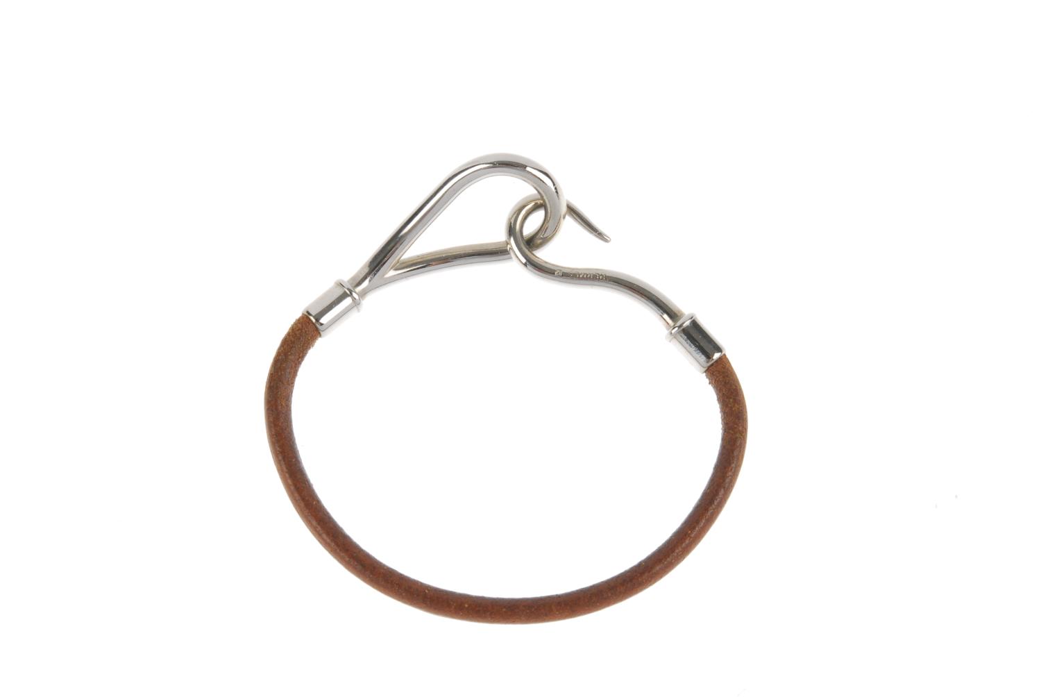 HERMÈS - a leather cord bracelet. The brown leather cord, with hook to one terminal and loop to - Image 2 of 3