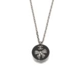 CHANEL - a resin Crystal Bow CC pendant. Designed as black and clear resign disc, featuring an