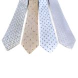 CHANEL - four silk ties. To include one pale blue tie with a four leaf clover design, a light blue