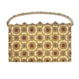 An early 20th century gem-set evening handbag attributed to Van Cleef & Arpels. The gold textile