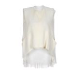 CÉLINE - a two-piece outfit. With a cream dipped hem, sleeveless blouse with a pleated sheer back,