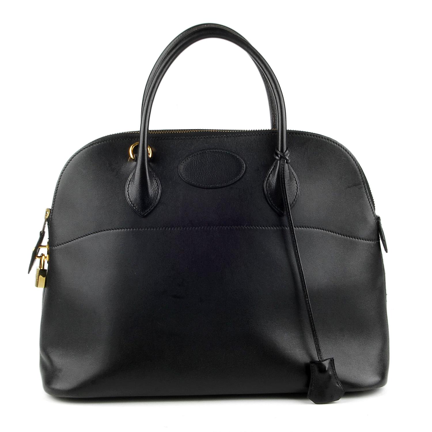 HERMÈS - a 1992 black Bolide handbag. Designed with a smooth black leather exterior and gold-tone
