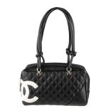 CHANEL - a Ligne Cambon quilted bowler handbag. Featuring a smooth black lambskin leather exterior