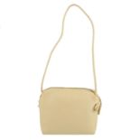 BOTTEGA VENETA - a small vintage beige handbag. Designed with a beige textured vinyl exterior,