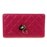 CHANEL - a Porte Bonheur wallet. Designed with a quilted hot pink leather exterior, featuring two