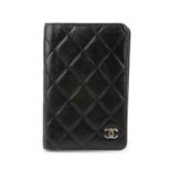 CHANEL - a lambskin leather Agenda Cover. Crafted from soft diamond quilted black lambskin