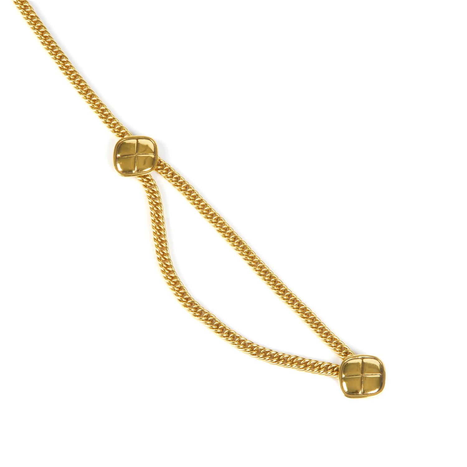 CHANEL - a chain belt. Featuring a gold-tone chain with a second draped chain, two large