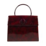 CARTIER - a vintage top handle Happy Birthday Bordeaux handbag. Designed with a structured shape,