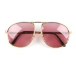 DUNHILL - a pair of vintage sunglasses. Featuring pink tinted lenses and matte gold-tone titanium