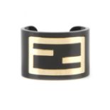 FENDI - a logo cuff. A black acrylic cuff featuring large gold-tone FF logo. Inner diameter 5.