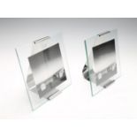 GEORG JENSEN - four medium Reflection picture frames. Crafted from stainless steel and glass,
