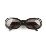 CARTIER - a pair of prescription sunglasses. Designed with black acetate frames, rounded rims and