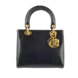 CHRISTIAN DIOR - a black Lady Dior lizard skin handbag. Crafted from black lizard skin, featuring