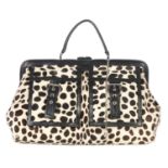 CÉLINE - a Dalmatian print pony hair handbag. Designed with a structured hinged top frame with