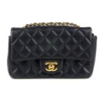 CHANEL - a navy blue New Mini Classic Flap handbag. Crafted from navy blue diamond quilted