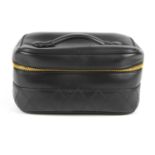 CHANEL - a small leather vanity case. Crafted from smooth black diamond quilted leather, featuring a