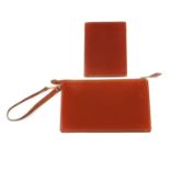 HERMÈS - a leather pouch and wallet. Both crafted from smooth chestnut brown leather, the pouch
