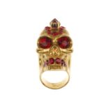 ALEXANDER MCQUEEN - a Punk Skull ring. Designed as a gold-tone skull, featuring red pyramid and