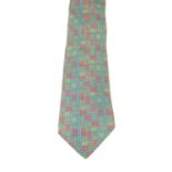 HERMÈS - a silk tie. Featuring a green and pink belt link pattern. Length 146cms. Tie is in very