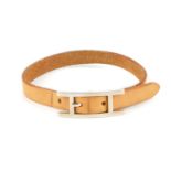 HERMÈS - a leather bracelet. Designed as a tan leather strap with silver-tone 'H' buckle