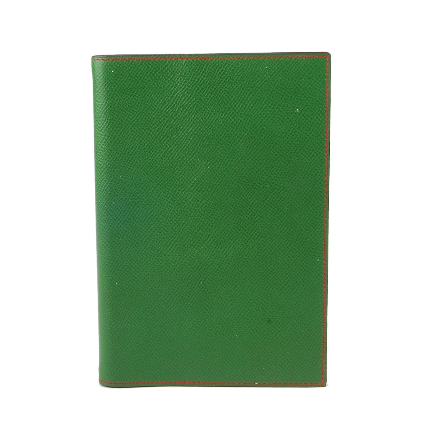 HERMÈS - a two-tone agenda dairy cover. Designed with a green leather exterior and contrasting red