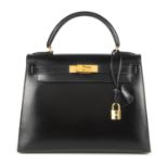 HERMÈS - a 1992 black Kelly Sellier 28 handbag. Designed with a structured shape, crafted from